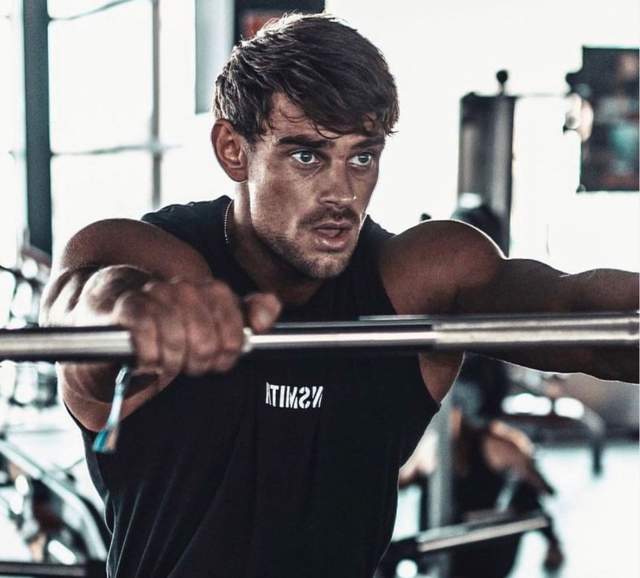 How Heavy Is a Bench Press Bar? Barbell Weight 101 - Gunsmith Fitness