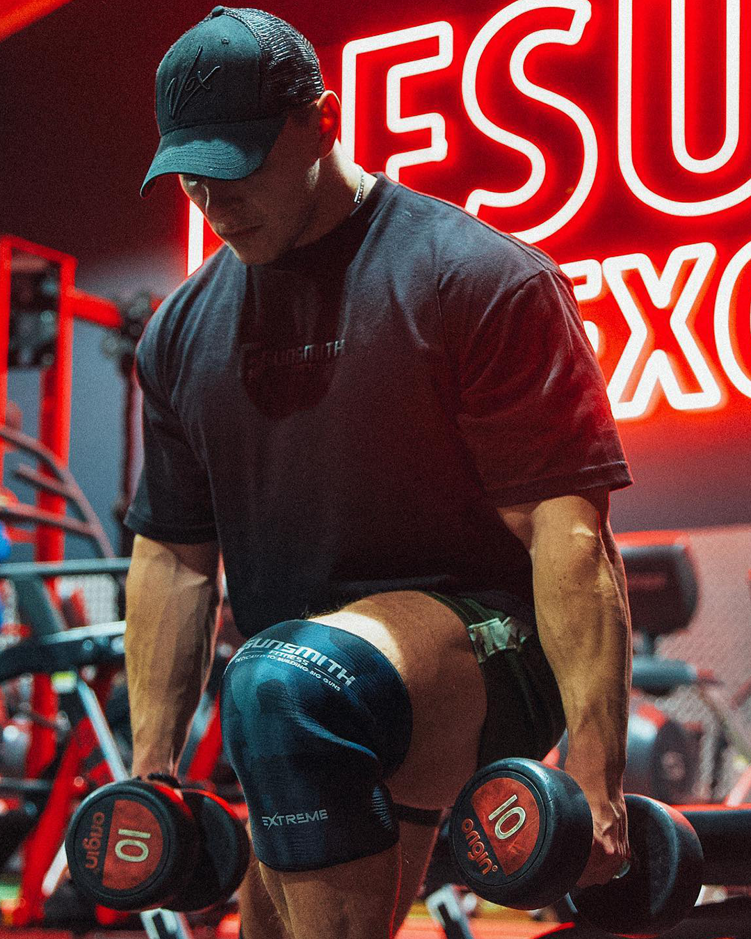 Athlete wearing Gunsmith Fitness apparel and the extreme knee sleeves