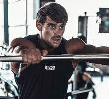 How Heavy Is a Bench Press Bar? Barbell Weight 101 - Gunsmith Fitness